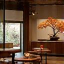 Interior shot of restaurant with Ikebana decoration.