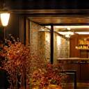 Restaurant exterior with welcoming floral art.